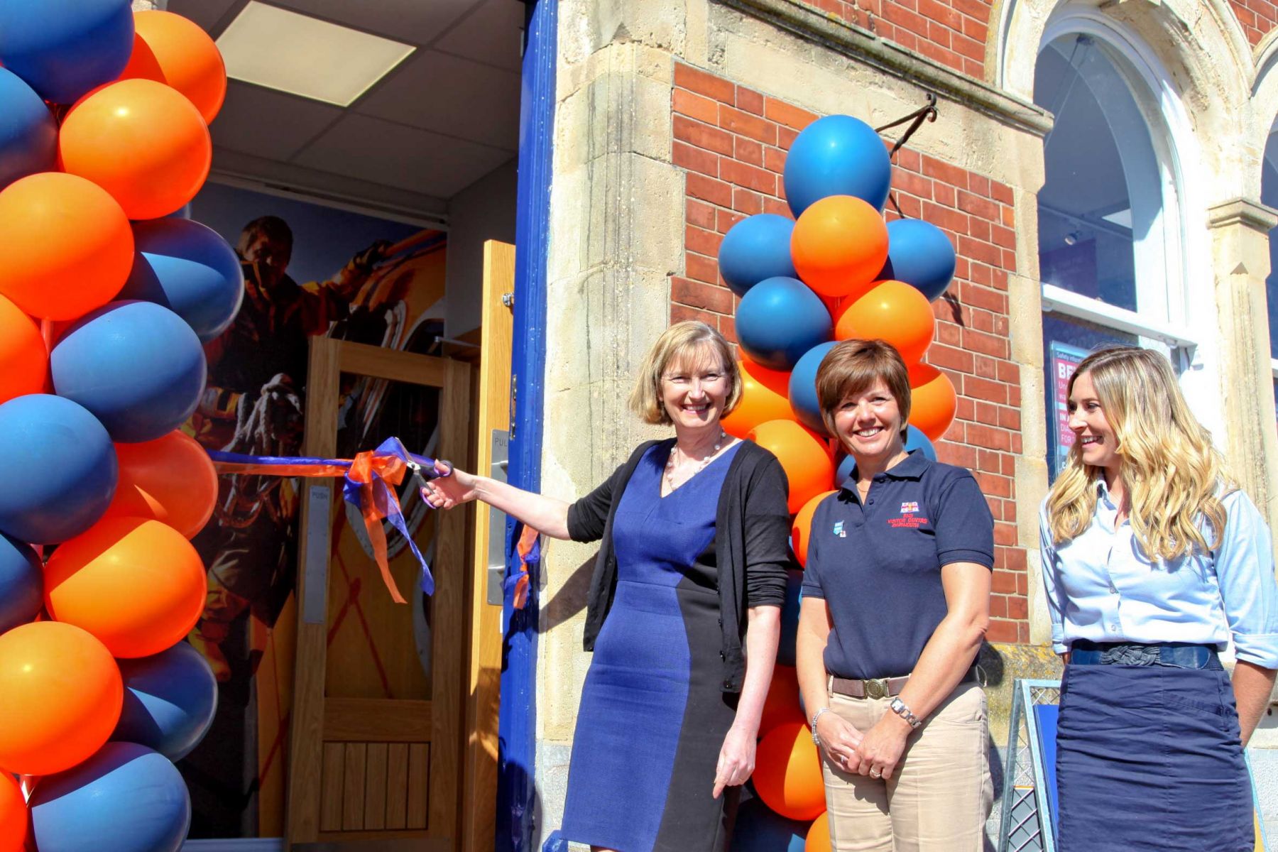 Sarah Wollaston MP opening the new Visitor Centre, supported by Tracey Lucas, Volunteer Manager and Amanda Woods, RNLI Visitor Experience Manager.