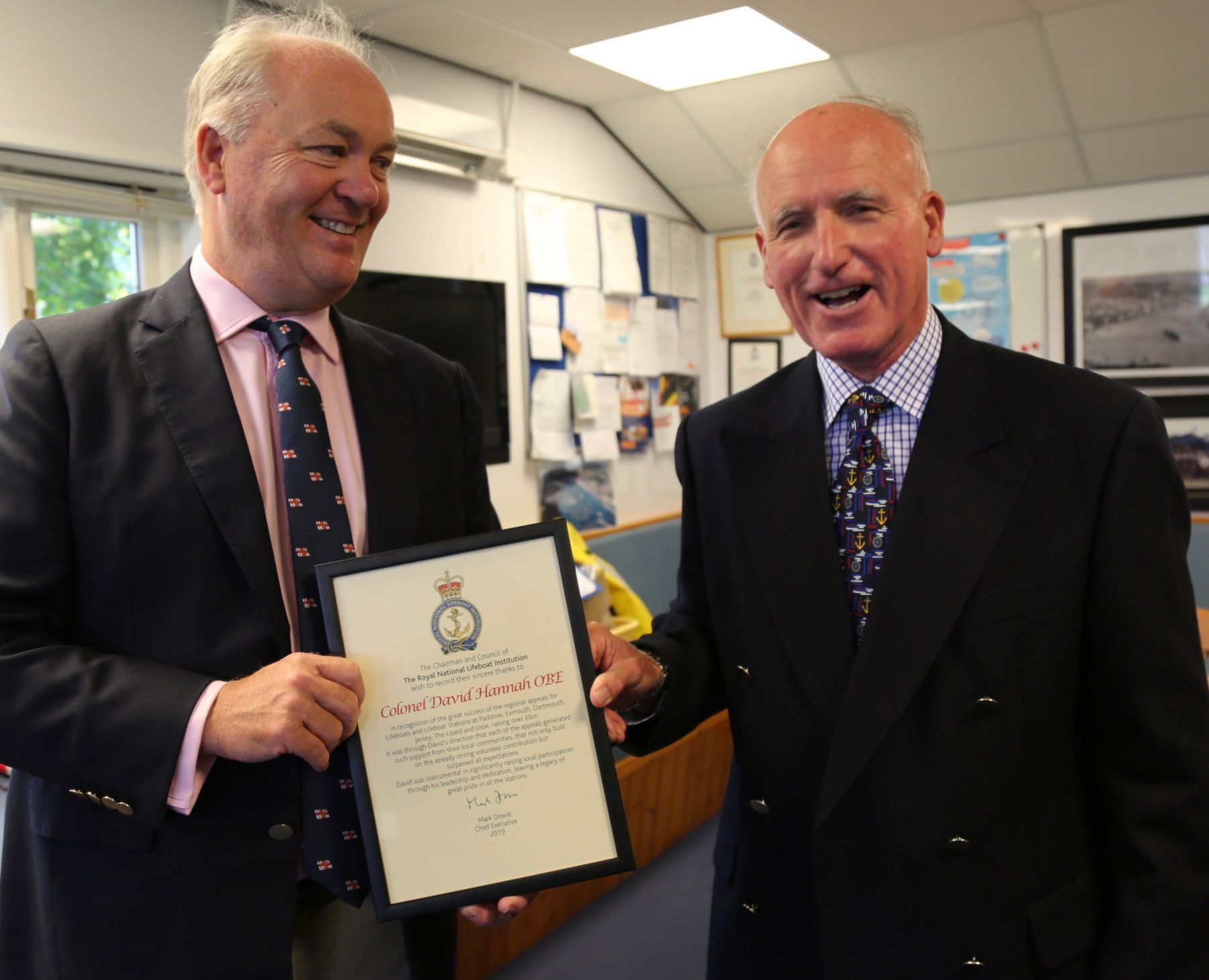 David Hannah being presented with his certificate by Mark Dowie RNLI CEO (Lt) 